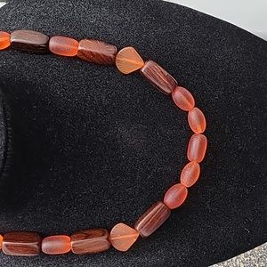 21 inch hand crafted necklace with wooden and tangerine glass beads
